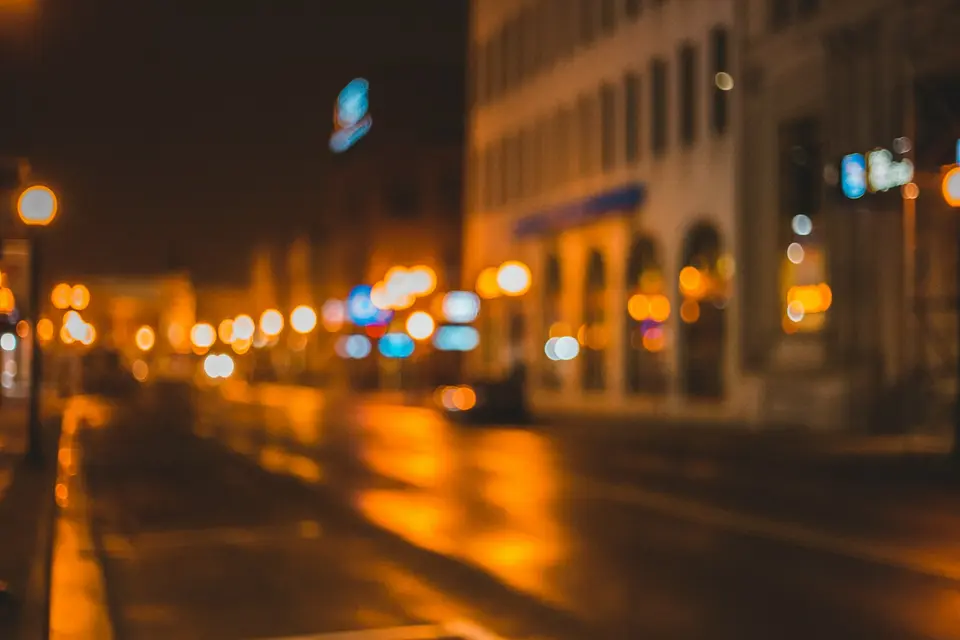 cars parked on side of the road during night time